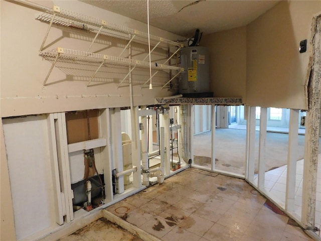 basement featuring electric water heater