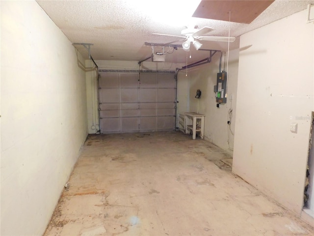 garage with a garage door opener and electric panel