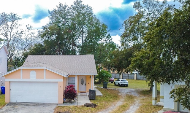 view of front of home with a garage and a front yard