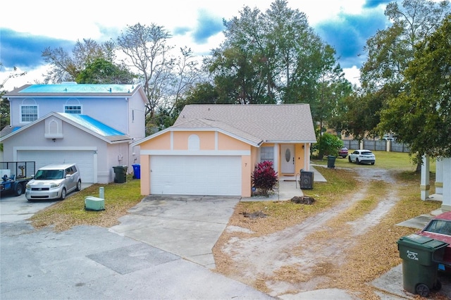 view of front of property with a garage and a front yard