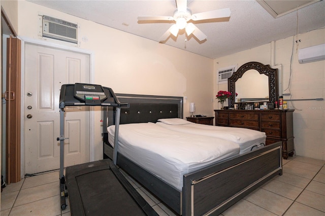 tiled bedroom with an AC wall unit and ceiling fan