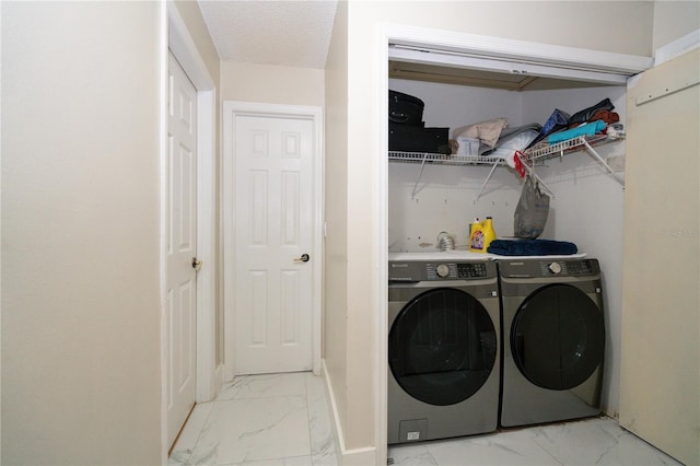 laundry room featuring separate washer and dryer