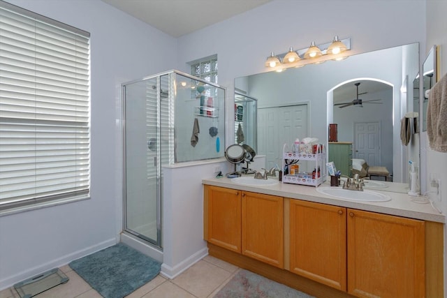 bathroom with vanity, a shower with door, tile patterned floors, and ceiling fan