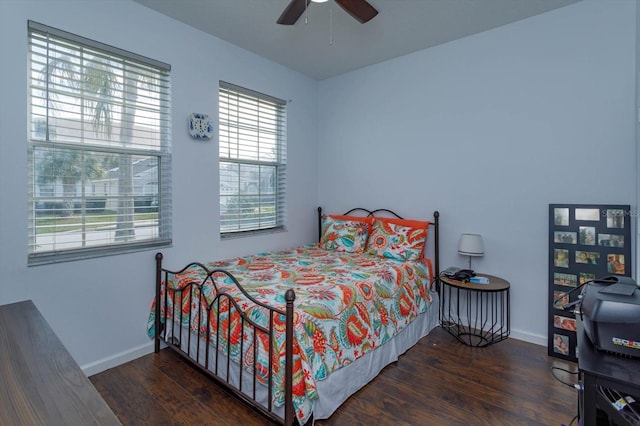 bedroom featuring dark hardwood / wood-style floors and ceiling fan