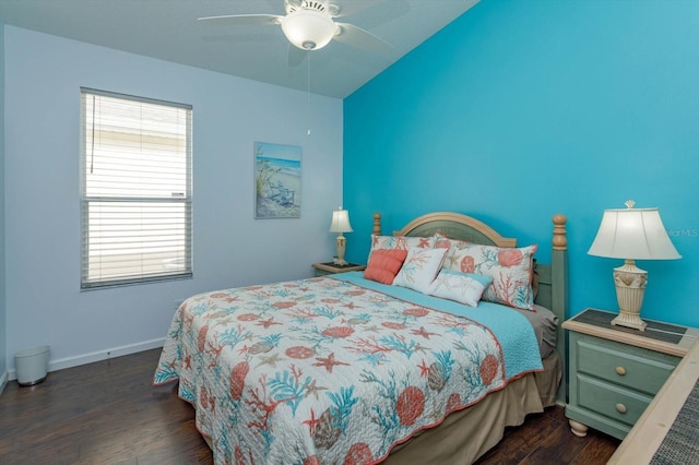 bedroom featuring multiple windows, dark wood-type flooring, and ceiling fan