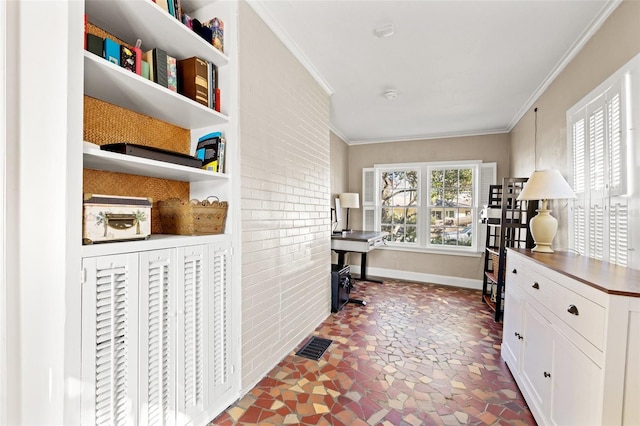 office space featuring crown molding and brick wall