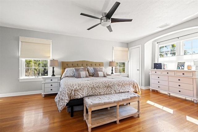 bedroom with ceiling fan and light wood-type flooring