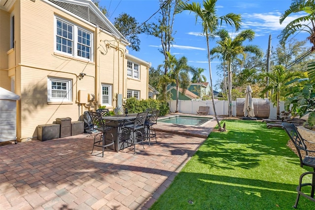 view of patio featuring a fenced in pool