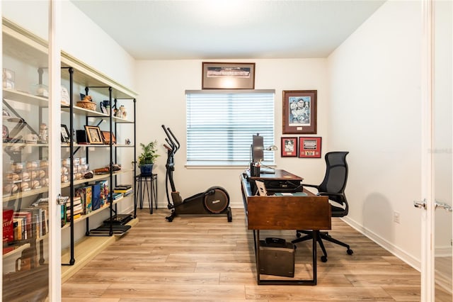 office area with light hardwood / wood-style floors