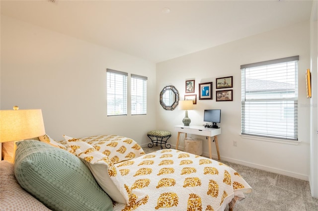 bedroom featuring light colored carpet