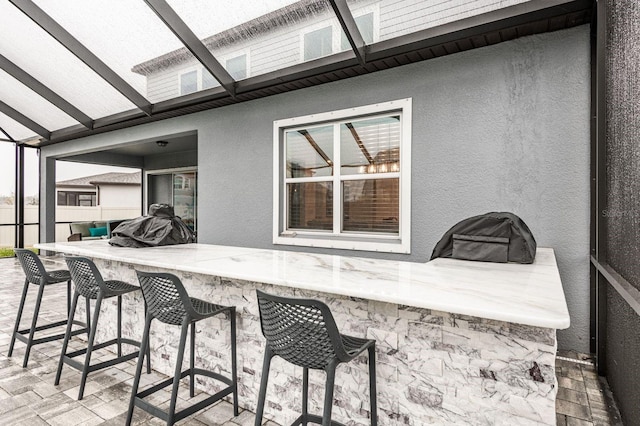 view of patio featuring an outdoor bar