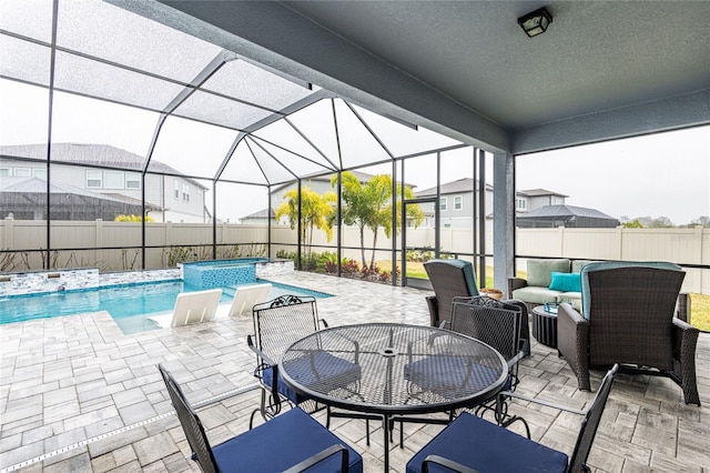 view of patio / terrace with a fenced in pool, a lanai, and outdoor lounge area