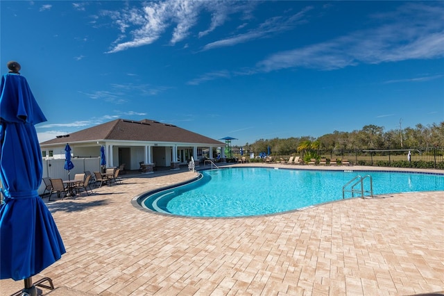 view of swimming pool with a patio