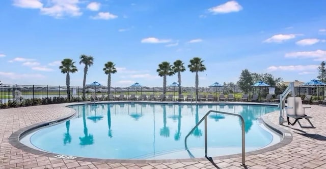 view of swimming pool featuring a patio area