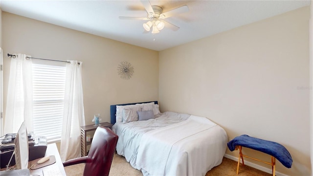 bedroom featuring multiple windows, carpet flooring, and ceiling fan