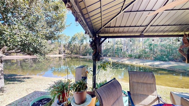 view of patio featuring a water view