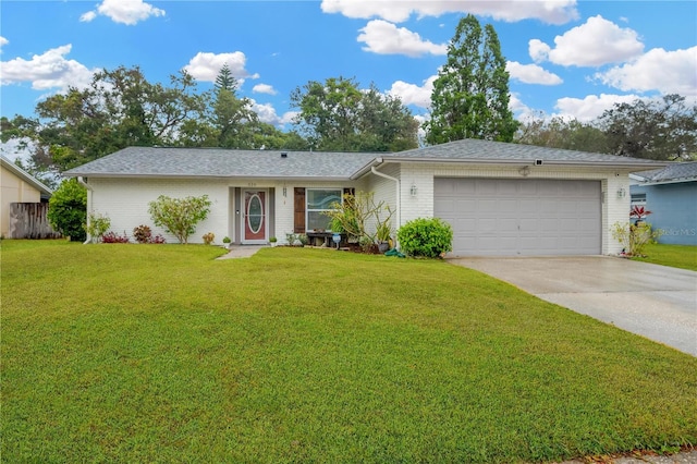 single story home with a garage and a front lawn