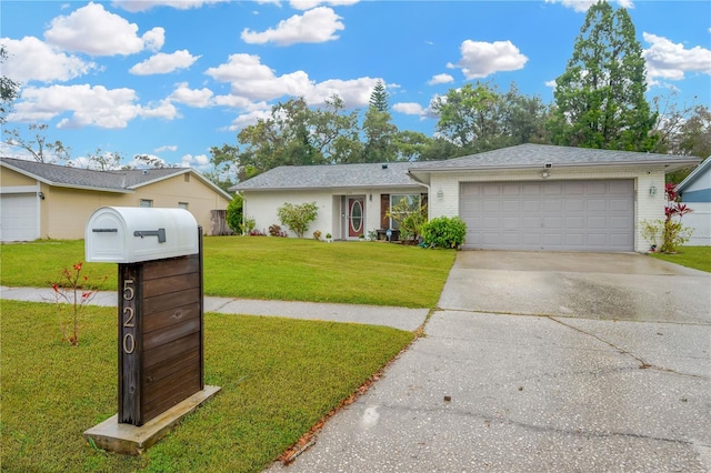 single story home featuring a garage and a front yard