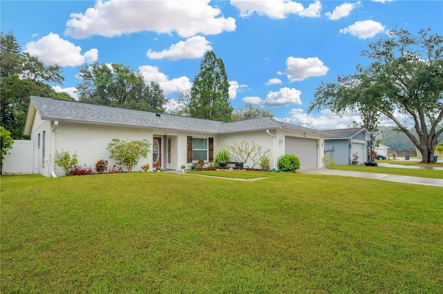 ranch-style home featuring a garage and a front yard