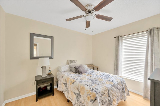 bedroom featuring ceiling fan and light hardwood / wood-style flooring