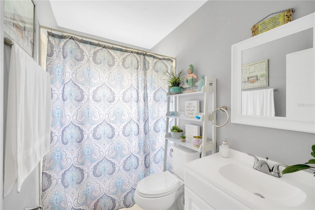 bathroom with a shower with curtain, vanity, and toilet