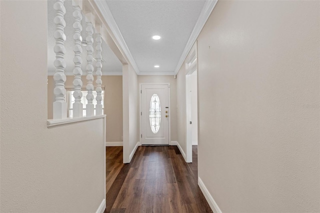 doorway to outside with crown molding and dark hardwood / wood-style floors