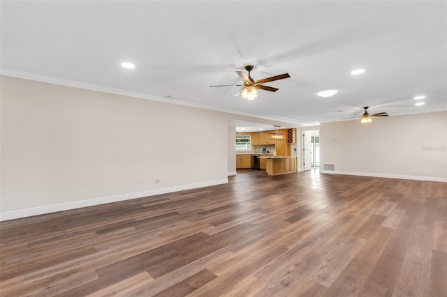 unfurnished living room featuring crown molding, dark wood-type flooring, and ceiling fan