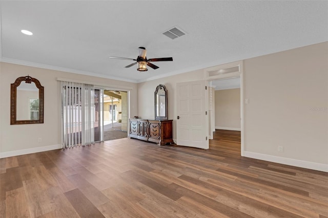 empty room with ceiling fan, wood-type flooring, and ornamental molding