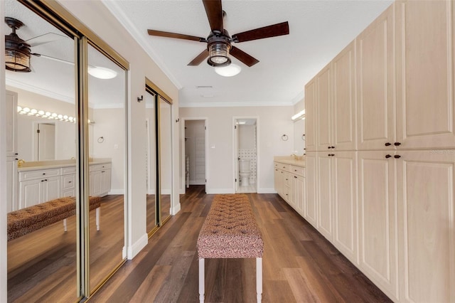 interior space with ornamental molding and dark hardwood / wood-style floors