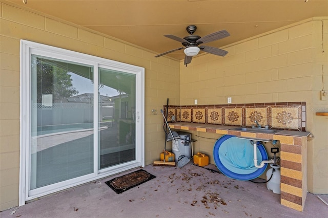 view of patio / terrace with sink and ceiling fan