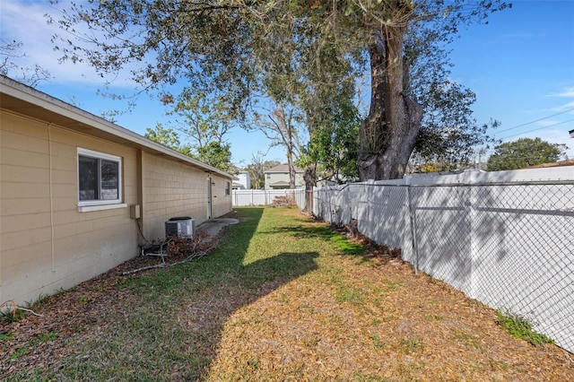 view of yard with central AC