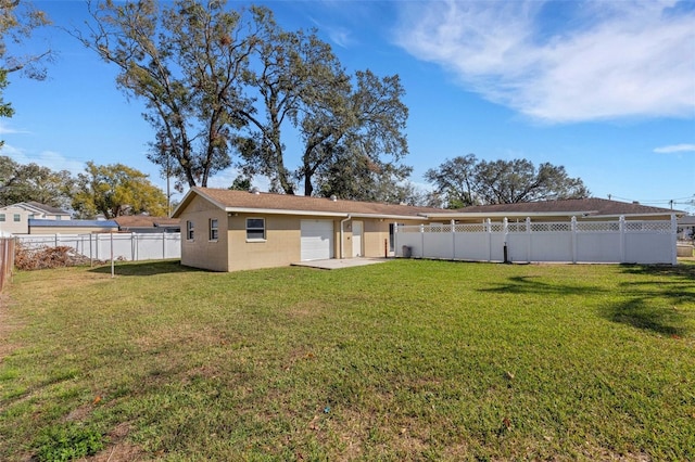 back of property featuring a lawn