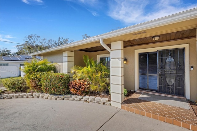 entrance to property featuring a patio