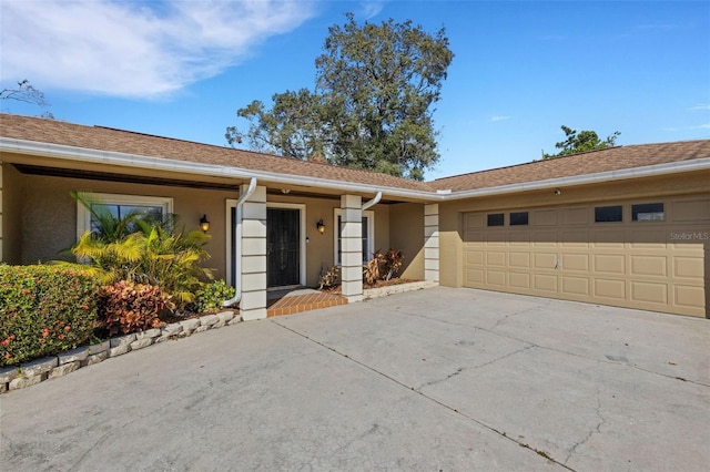 ranch-style house featuring a garage