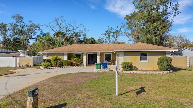 ranch-style home with a front lawn