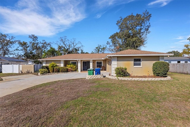 ranch-style house with a front lawn