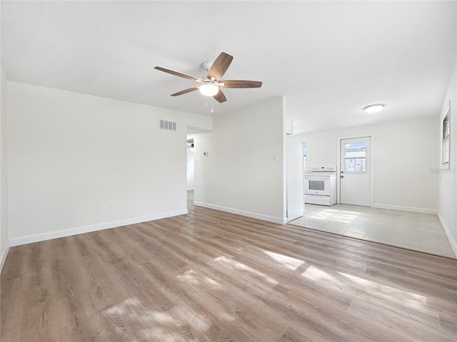 unfurnished living room with ceiling fan and light hardwood / wood-style floors