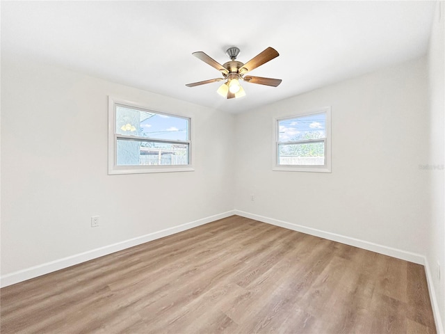 unfurnished room with light hardwood / wood-style floors and ceiling fan