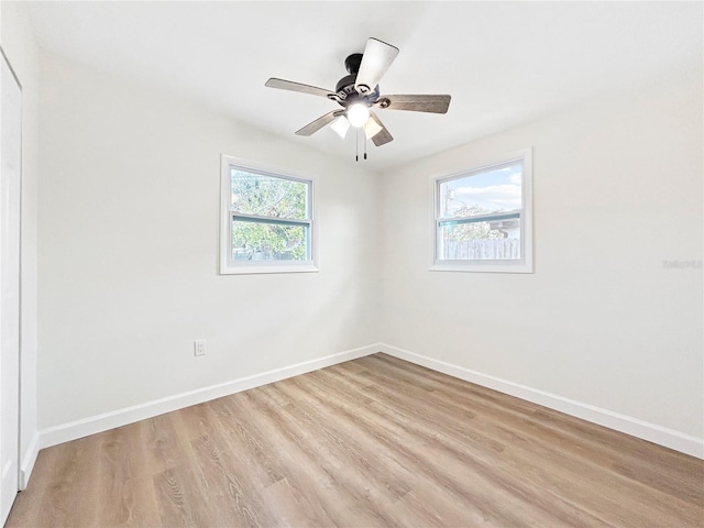 spare room featuring ceiling fan and light hardwood / wood-style floors