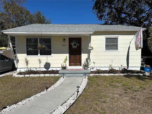 view of front of home with a front lawn