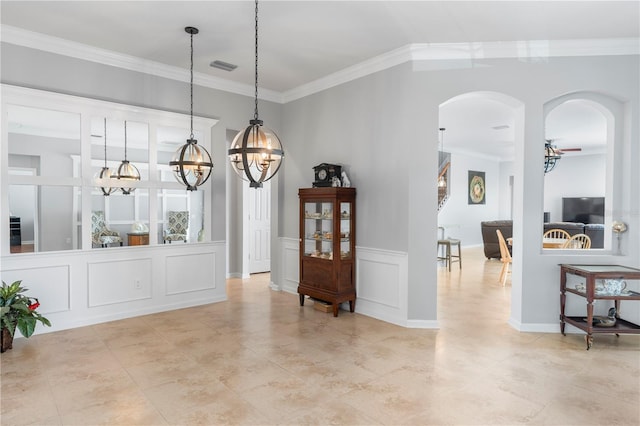 dining room featuring crown molding and a chandelier