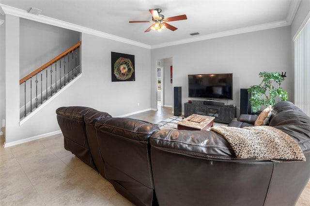 living room with crown molding, a wealth of natural light, and ceiling fan