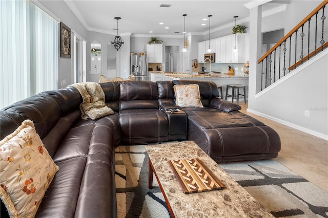 living room with ornamental molding and light tile patterned floors