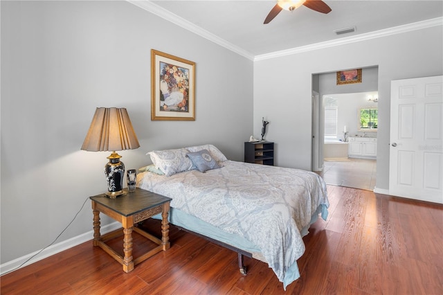 bedroom featuring crown molding, wood-type flooring, connected bathroom, and ceiling fan