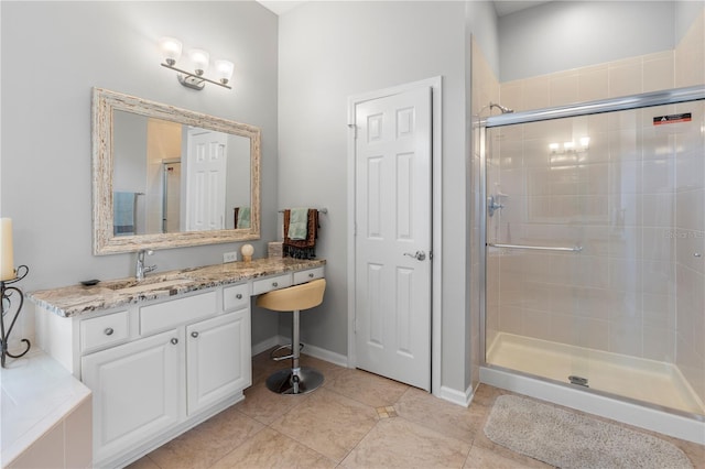 bathroom with vanity, tile patterned floors, and walk in shower