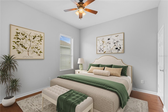 bedroom with hardwood / wood-style flooring and ceiling fan