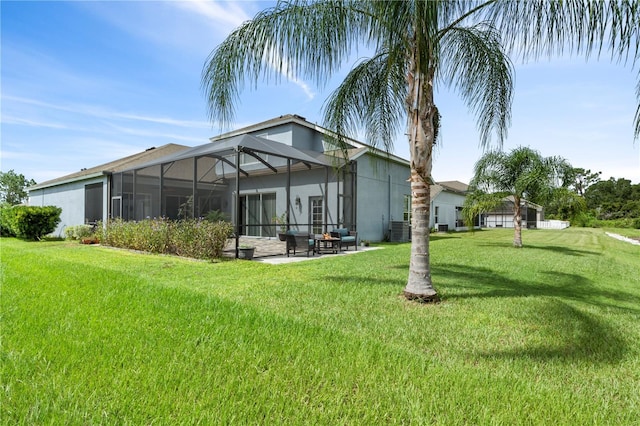 rear view of house with central AC, a lanai, and a lawn