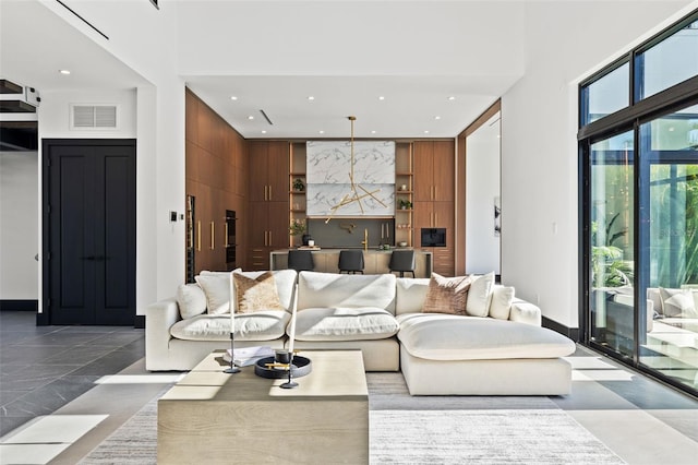 living room with a towering ceiling