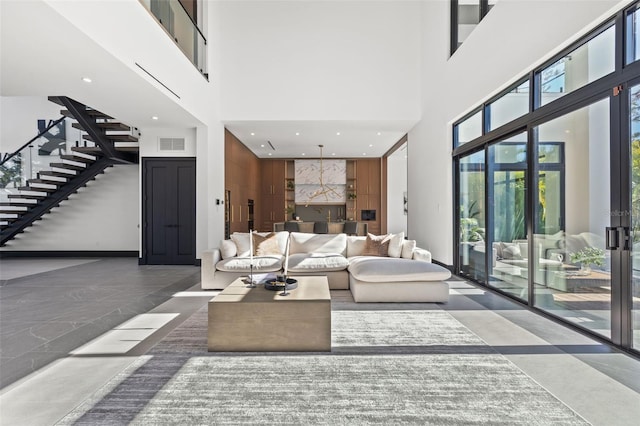 living room featuring a high ceiling