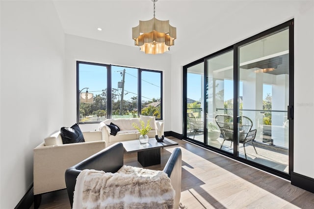 interior space with a notable chandelier and hardwood / wood-style floors